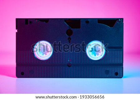 Video cassete on color background. Retro vhs cassette tape, close up