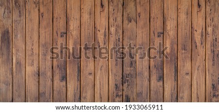Brown wood texture background coming from natural tree. The wooden panel has a beautiful dark pattern, hardwood floor texture Royalty-Free Stock Photo #1933065911