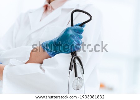 close up. stethoscope in the hand of a woman doctor .