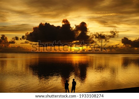 This is a picture of the sea at sunset in the Pacific Ocean on Saipan Island, USA.