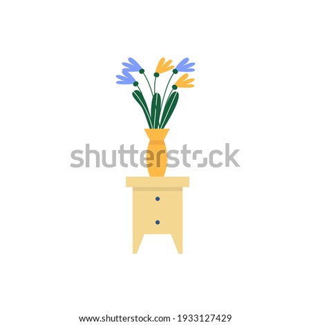 A vase of flowers sits on the bedside table