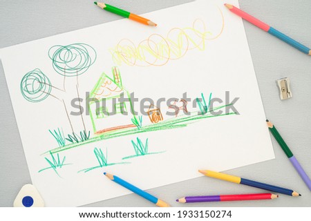 Children's drawing, colored pencils lie on the table. Greeting card. family, mother, and children's day
creativity, family, motherhood, leisure and people concept