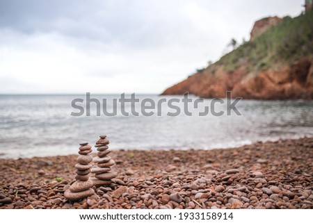 Pebbles stacked on the beach 