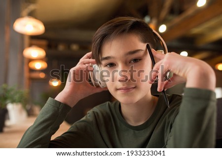 Little boy wearing headphones during online education course, lesson, view of screen. Using headphones. Easy, comfortable usage concept, education, online, childhood, modern technologies for remotion.