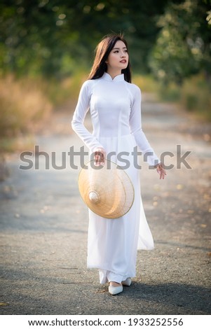 Ho Chi Minh City, Vietnam: Portrait women in white ao dai Vietnam, The Ao dai ( long-dress Vietnamese) is traditional costume of Vietnamese woman