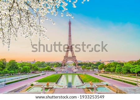 Paris Eiffel Tower and Trocadero garden at spring sunset in Paris, France. Eiffel Tower is one of the most famous landmarks of Paris., toned Royalty-Free Stock Photo #1933253549