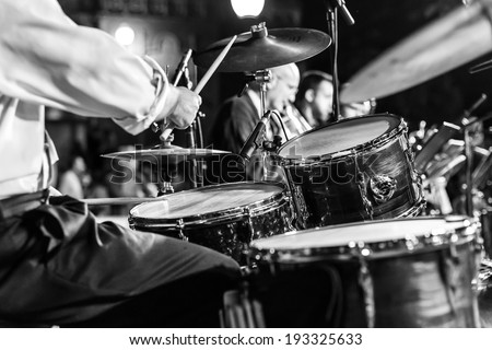At a concert musician playing his instrument Royalty-Free Stock Photo #193325633