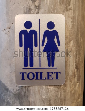 Close up of toilet sign on wall