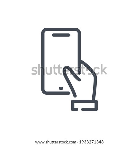 Hand hold mobile phone line icon. Hand holding smartphone vector outline sign. Royalty-Free Stock Photo #1933271348