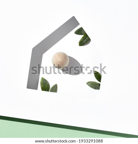 Easter minimal background with house silhouette and eggs. Sunshine with harsh shadow. Happy easter 2021 creative concept. Flat lay, top view