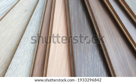 engineering or veneer wooden flooring ,click-lock type ,samples palette contains multi color tone and pattern of oak wood.  Royalty-Free Stock Photo #1933296842