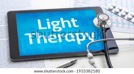 The word Light Therapy on the display of a tablet