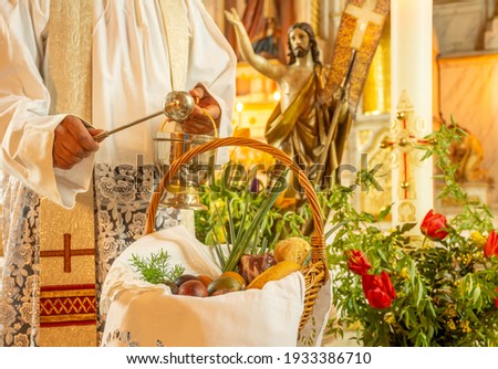 Easter food basket for blessing in church, catholic eastern european custom with eggs, spring onion, ham and bread Royalty-Free Stock Photo #1933386710
