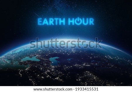 Earth Hour event. Planet Earth in dark outer space. Orbit and surface. Elements of this image furnished by NASA Royalty-Free Stock Photo #1933415531