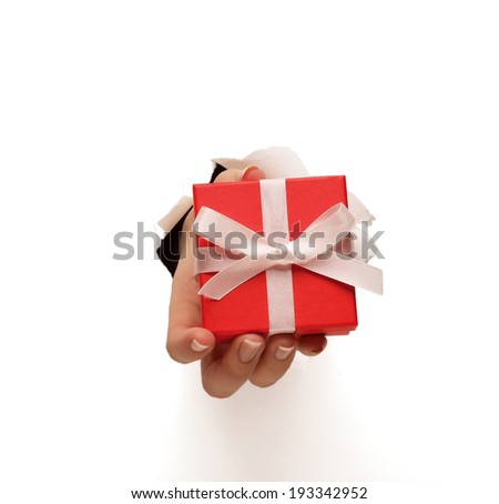 Hand breaking white paper showing gift box isolated