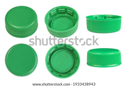 Set of plastic green bottle caps isolated on white background Royalty-Free Stock Photo #1933438943