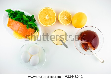 Foods containing collagen. Gelatin, eggs, fish, greens, citrus fruits containing collagen and are necessary for its synthesis for youthful skin and healthy joints. White background. Copy space.