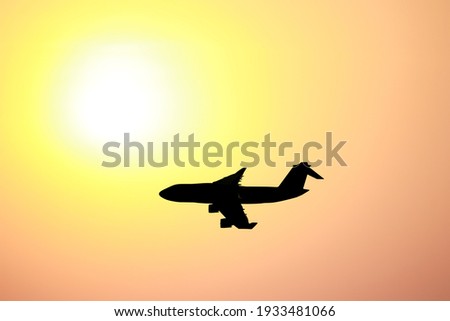 Aircraft with golden sun background