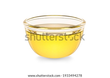 Vegetable cooking oil  in glass bowl isolated on white background. Royalty-Free Stock Photo #1933494278