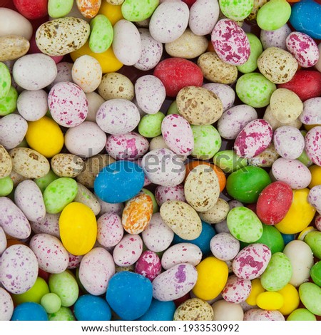 Candy background from multicolored round sugar pills