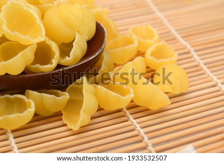 Close up of the background farfalle on the bamboo mat 