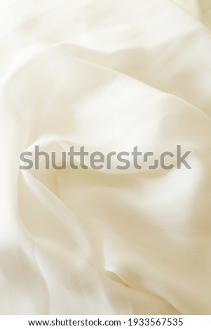 light cream colour smooth silky fabric background