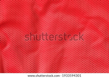 Sport clothing fabric texture background, Top view of cloth textile surface. Red jersey texture background