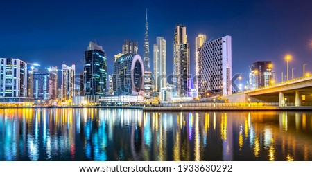 Panoramic view of Dubai Creek and night city skyline, United Arab Emirates, night Dubai ultra modern skyline Royalty-Free Stock Photo #1933630292