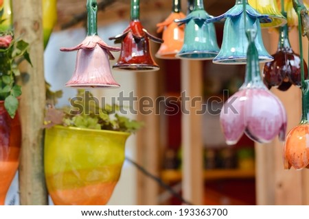 image of beautiful colorful ceramic bells in row decoration on market fair