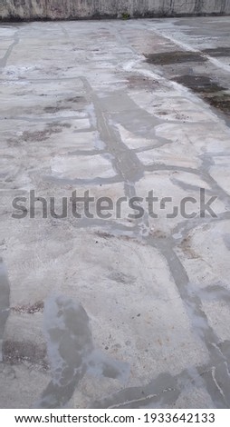 a flat concrete surface with a pattern