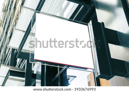 White square signboard on the wall of a modern business center, mockup