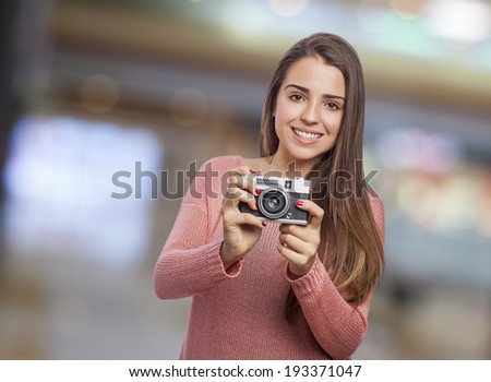young woman taking a photo