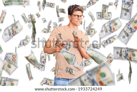 Young handsome man wearing casual clothes and glasses disgusted expression, displeased and fearful doing disgust face because aversion reaction. with hands raised