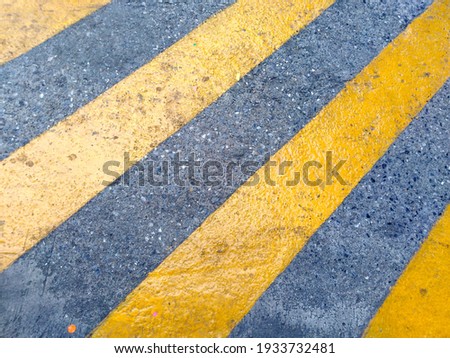 Yellow stripes on the road.