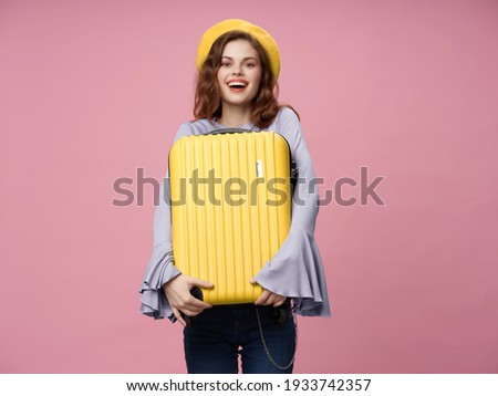 woman with yellow suitcase passenger luggage travel pink background