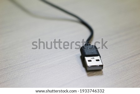 USB cable on wood background