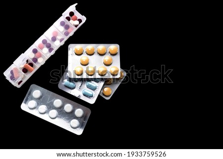 Tablets in standards of various shapes and colors. Copy space for your text. Medicines for everyday therapy.