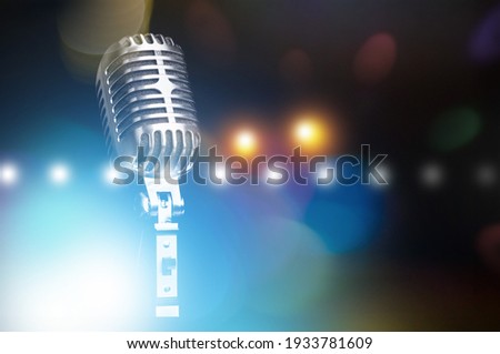 Retro style microphone on dark background