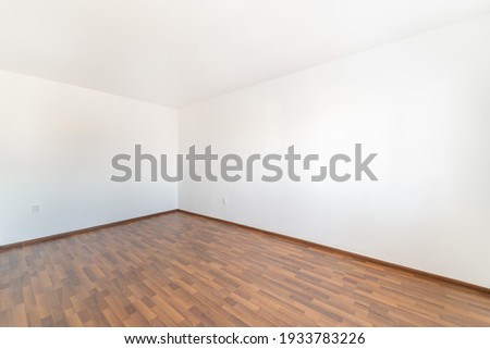 Empty room with wooden floor Royalty-Free Stock Photo #1933783226