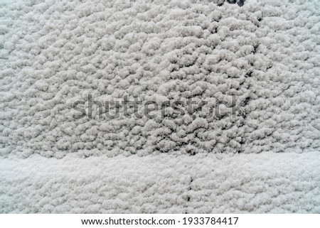 Snow covered car. Fresh snow on car in cold winter morning. Concept of driving in winter time with snow on road. Winter season. Copy space.