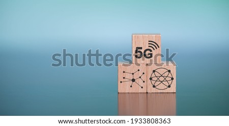 Concept of 5G with icons on wooden cubes