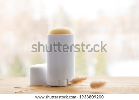 Making homemade deodorant stick with all natural ingredients concept. Antiperspirant on minimal background with lot of copy space. Royalty-Free Stock Photo #1933809200
