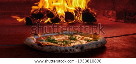 wide cover photo image of traditional wood fired oven pizza fresh baked brick inside pizzeria Royalty-Free Stock Photo #1933810898