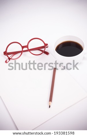 blank paper with coffee, glasses (soft color and vignette filtered)