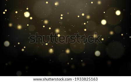 Festive abstract christmas texture, golden bokeh particles and highlights on dark background. High quality photo