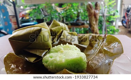 Green sticky rice tape green sticky rice is a traditional food made from fermented green glutinous rice from suji leaves. west java indonesia