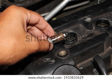 Maintenance spark plug of car