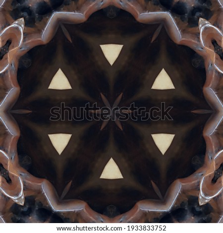 Kaleidoscope wooden table on a bamboo background.