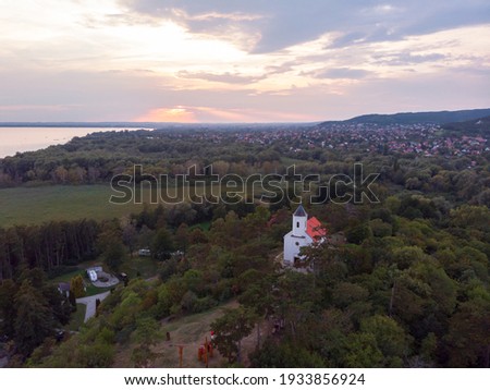 Aerial view of the hilltop chapel (St. Michael's Chapel) near Lake Balaton, at Vonyarcvashegy at sunset in Hungary