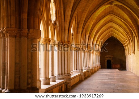 historical construction ancient cloister of gothic monastery hall Royalty-Free Stock Photo #1933917269